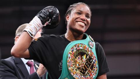 Caroline Dubois smiles with her WBC title around her shoulder
