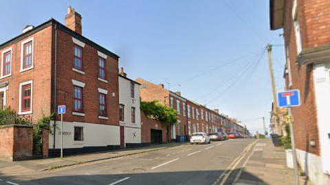 Street view of Crompton Street, at the junction with Green Lane, in Derby city centre.