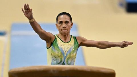 Oksana Chusovitina about to leap on a vault