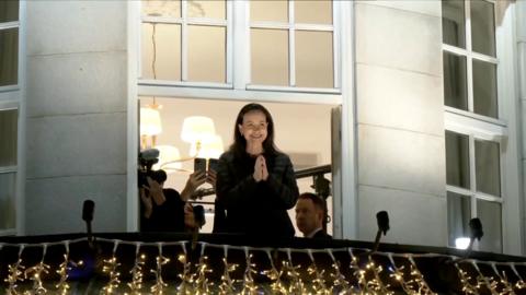 María Corina Machado watches crowd from hotel balcony