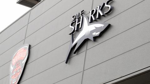 Salford Red Devils and Sale Sharks logos