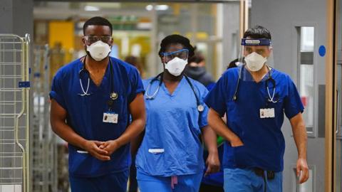 File photo dated 21/12/21 of medical staff wearing FFP3 face masks at King's College Hospital, in south east London.