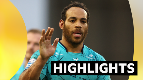 Huddersfield's Leroy Cudjoe waves to the fans