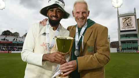 Nottinghamshire captain Haseeb Hameed and head coach Peter Moores holding the County Championship trophy