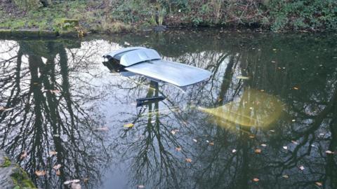 A car submerged in a canal near Saltaire
