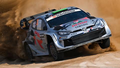 Elfyn Evans drives his Toyota Yaris through sand at Rally Saudi Arabia