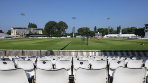 The Derbyshire CCC ground from the stands, with three floodlights on view