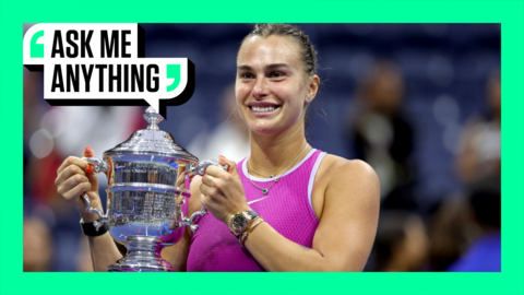 Aryna Sabalenka smiles holding up the US Open trophy