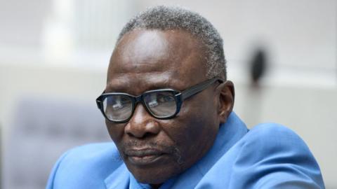 Ali Muhammad Ali Abd-Al-Rahman looks ahead at the hearing, wearing a light blue suit