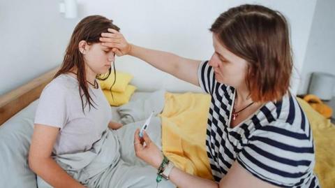 Sick child and mother