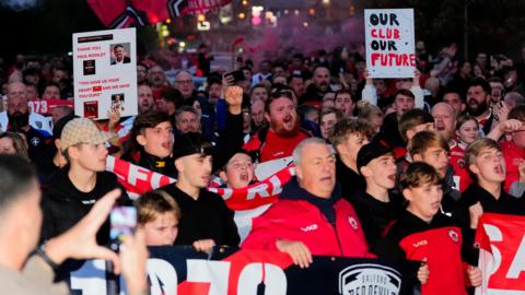 Salford Red Devils fans protest against the club's ownership in the lead up to their final game of the 2025 Super League season