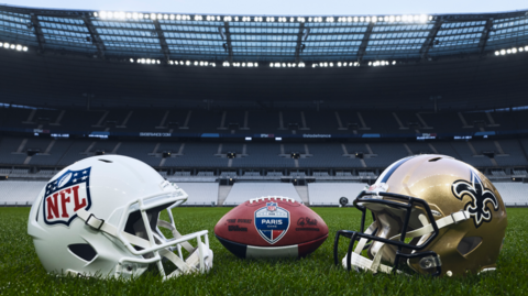 NFL and New Orleans Saints helmets on the Stade de France field