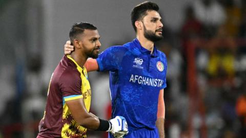 West Indies' Nicholas Pooran and Afghanistan's Naveen-ul-Haq during a match in 2024