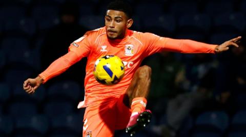 Coventry City's Kaine Kesler-Hayden stretches to control the ball during a game
