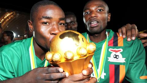 Nathan Sinkala and Noah Sikombe Chivuta (right) of Zambia celebrate with the trophy after winning the 2012 African Cup of Nations