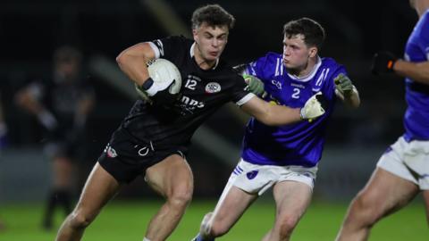 Action from KIlcoo's win over Scotstown in 2024