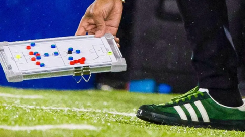 Wilfried Nancy's trainers and mini tactics board