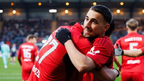 Adil Aouchiche celebrates after scoring for Aberdeen against Dundee