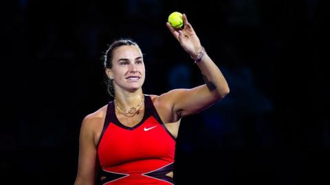 Aryna Sabalenka holds up a tennis ball