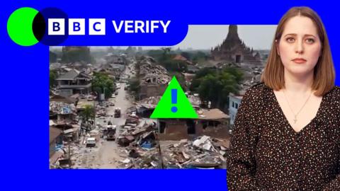 A composite image that shows an AI-generated image on the left, and BBC reporter Olga Robinson on the right. The AI-generated image on the left shows an aerial view of destroyed buildings, claimed to be the from aftermath of the earthquake in Myanmar. There are several tall temples and palm trees along the landscape. In front is a road with damaged buildings and debris scattered around. The BBC Verify blue logo and a red label that reads AI generated are over the top. On the right hand side, BBC reporter Olga Robinson looks into the camera with a serious expression. She has light brown hair cut in a bob, and is wearing a black blouse with small red and white flowers.