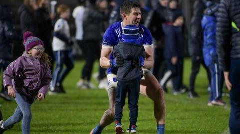 Darren Hughes celebrates with his children, Cillian and Ava