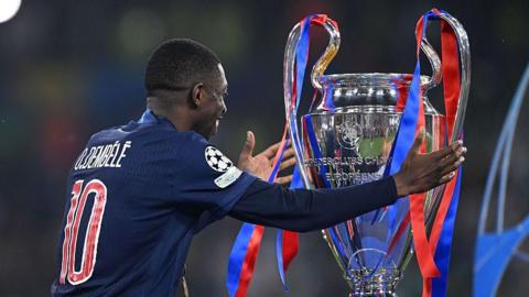 Ousmane Dembele with the Champions League trophy
