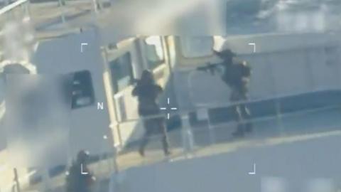 Military personnel are posting their guns.