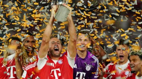 Bayern Munich's Harry Kane with Bundesliga trophy