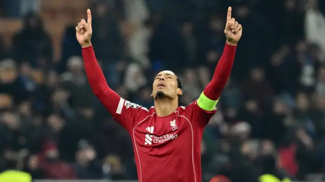 Virgil van Dijk with his hands in the air