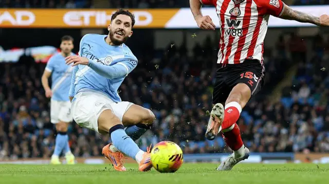 Rayan Cherki of Manchester City and Omar Alderete of Sunderland challenge during the Premier League match between Manchester City and Sunderland