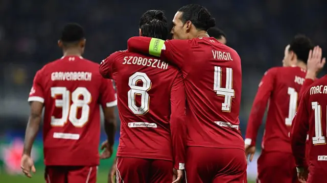 Liverpool players celebrate a goal