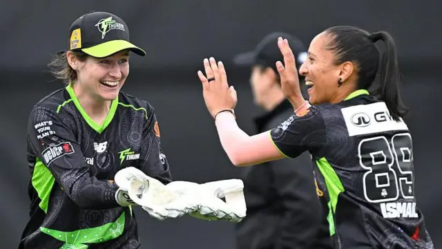 Tahlia Wilson and Shabnim Ismail celebrate a wicket