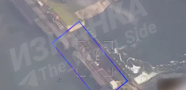 Drone footage of the dam about to be hit by an air strike, you can see the drone's heads up display data and target box