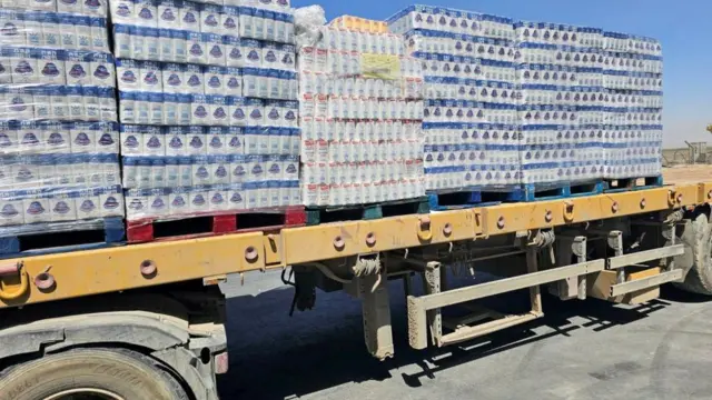 A large truck with lots of packages on it.