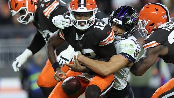 Cleveland Browns quarterback Shedeur Sanders is sacked while playing against the Baltimore Ravens