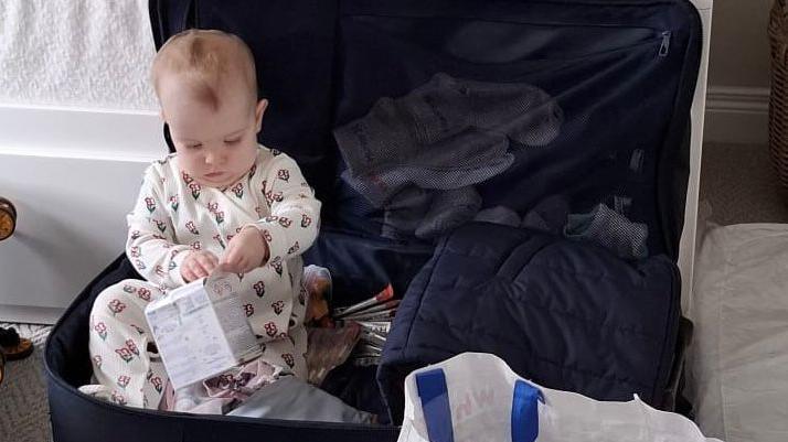 Baby Charlotte packing for her trip to Singapore to cheer on mum, Bethany Firth