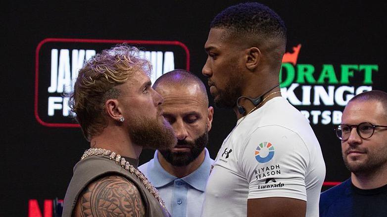 Jake Paul faces off with the much taller Anthony Joshua