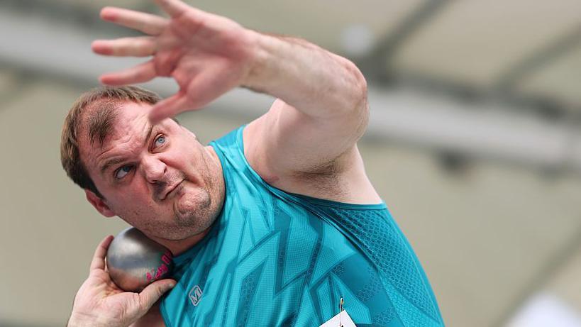 Vladimir Sviridov taking part in shot put