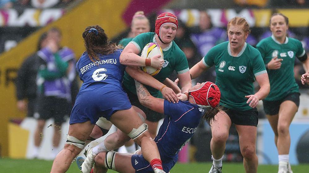 Ireland's Aoife Wafer is tackled playing against France