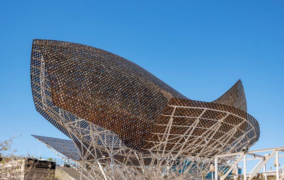 Peix d'Or, Goldfish sculpture designed by Frank Gehry, in Barcelona is seen against a bright blue sky