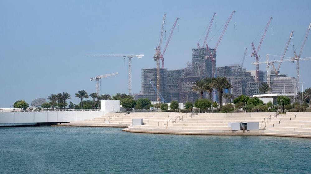 The construction of Abu Dhabi's Guggenheim museum seen in 2023 from the Louvre Abu Dhabi
