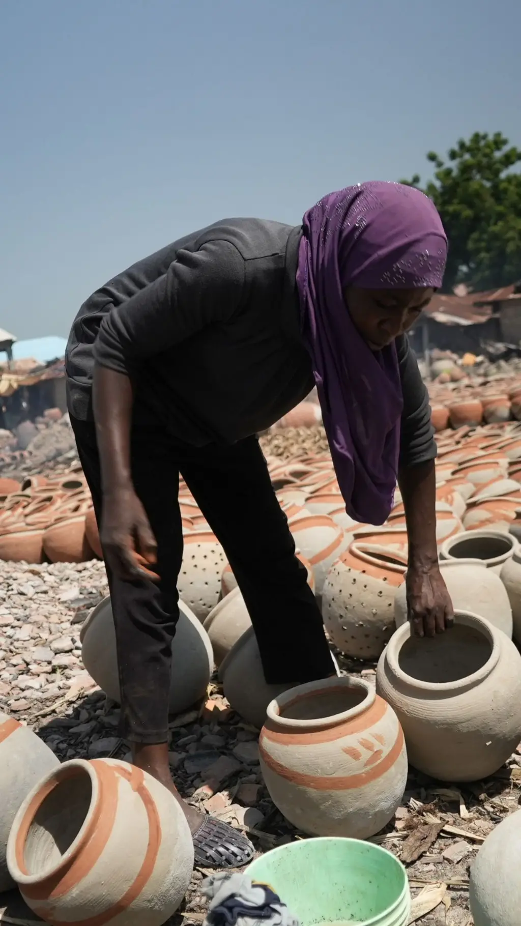 A woman with local pots