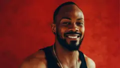 Nigerian actor Etim Effiong dey smile