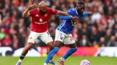 Manchester United's Bryan Mbeumo (left) and Sunderland's Arthur Masuaku (right)