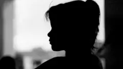 কালো ব্যাকগ্রাউন্ডে একটি শিশুর প্রতীকী ছবি