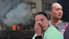 香港大埔火災現場及兩名受災住戶