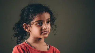 5 year old girl looking at camera