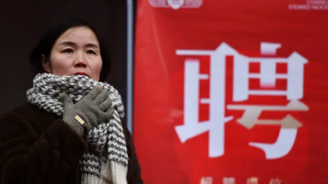 Job seekers are looking for suitable positions at a job fair for women in Fuyang, China, on March 6, 2024.