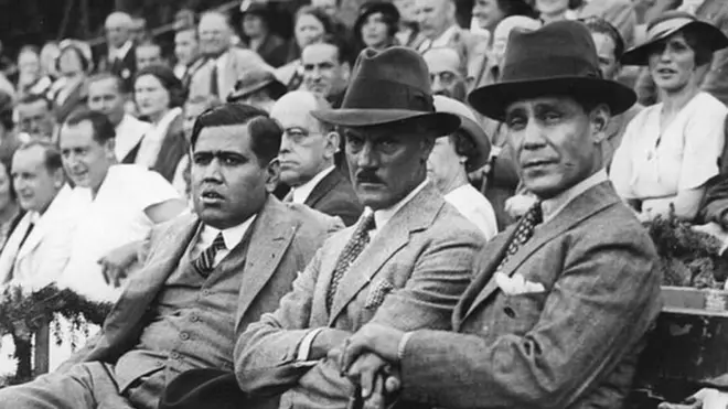 circa 1950: Sir Hamidullah Khan (1894 - 1960), the Nawab of Bhopal (right), sitting with Mr Haider and Colonel Hughdensville, watching an exhibition tennis match given in his honour. (Photo by Hulton Archive/Getty Images)