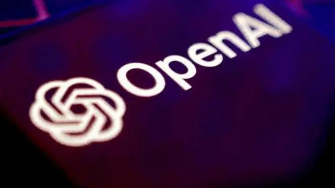 The OpenAI logo and company name are displayed against the backdrop of a darkened keyboard
